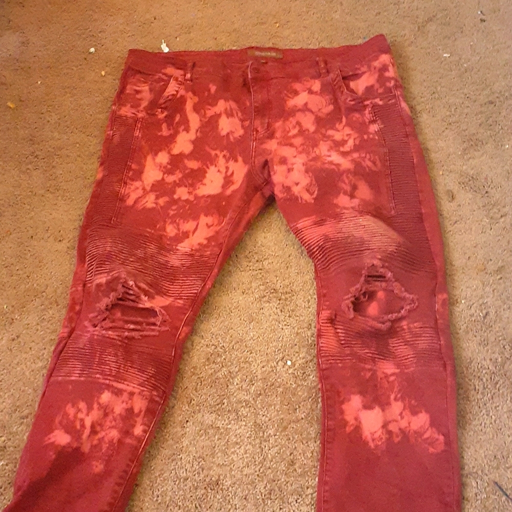 Red holey Jean's and black sweater